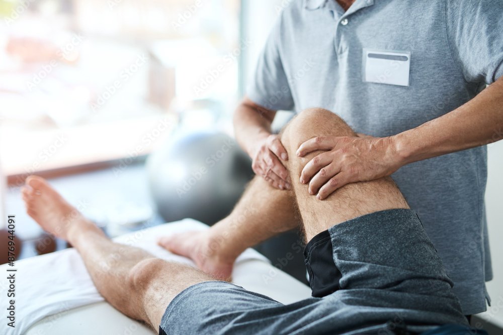 Healthcare, knee and physiotherapist with man patient in clinic for healing, rehabilitation or treatment. Physical therapy, stretch and medical worker with athlete for leg injury or accident recovery
